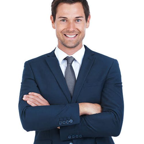 Cropped portrait of a handsome businessman standing with his arms folded isolated on white